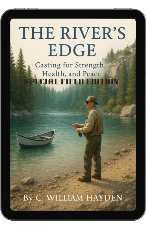 Digital tablet displaying the cover of The River’s Edge: Special Field Edition eBook resting on fly fishing gear beside a Montana mountain lake, with pine trees and snow-capped peaks in the background.”